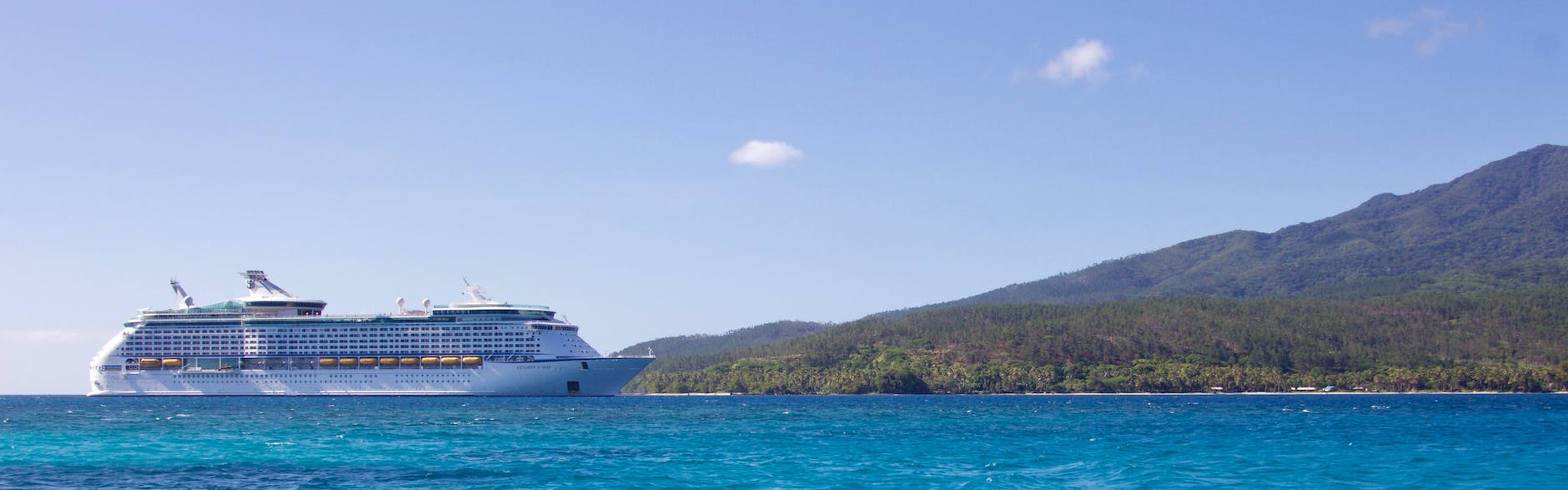 white cruise ship near island